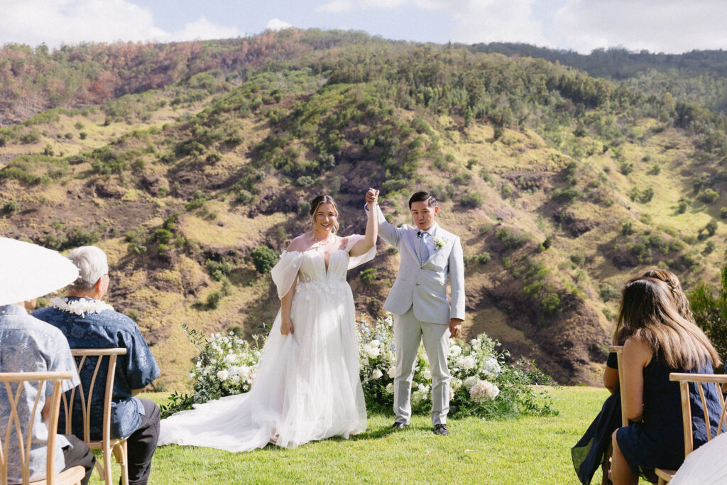 portrait of the newlyweds heading to their wedding reception