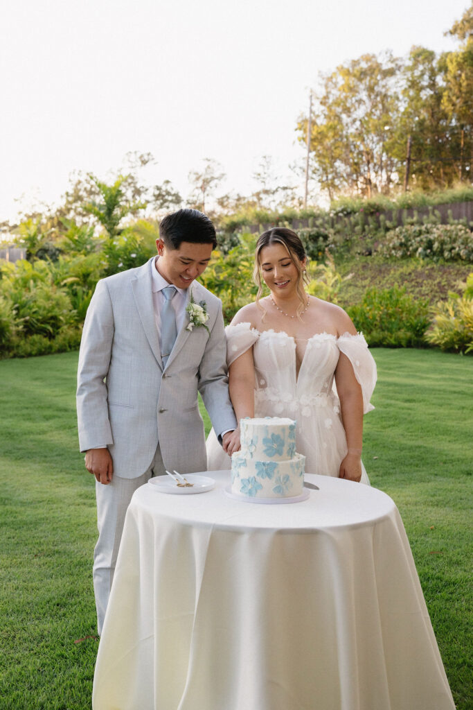 newlyweds cutting their wedding cake