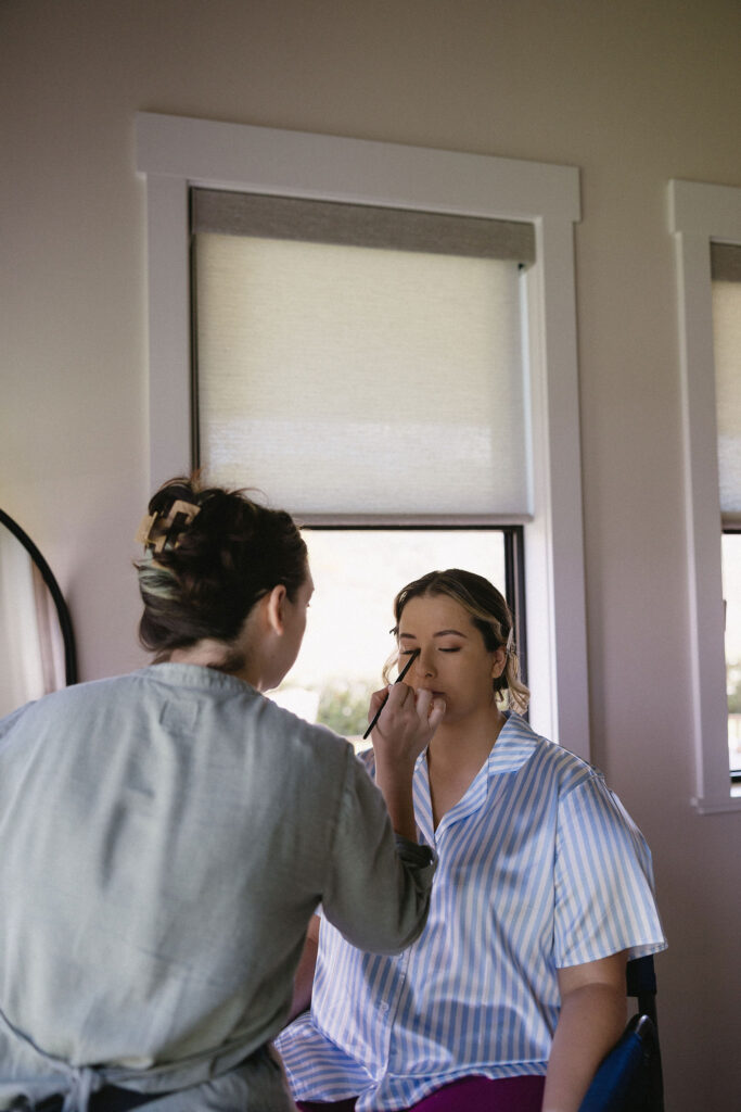 picture of the bride getting her makeup done