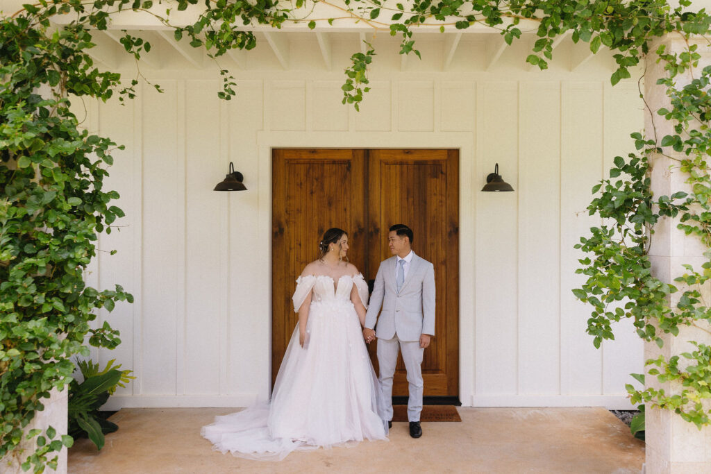 Cute picture of the bride and groom, smiling at each other