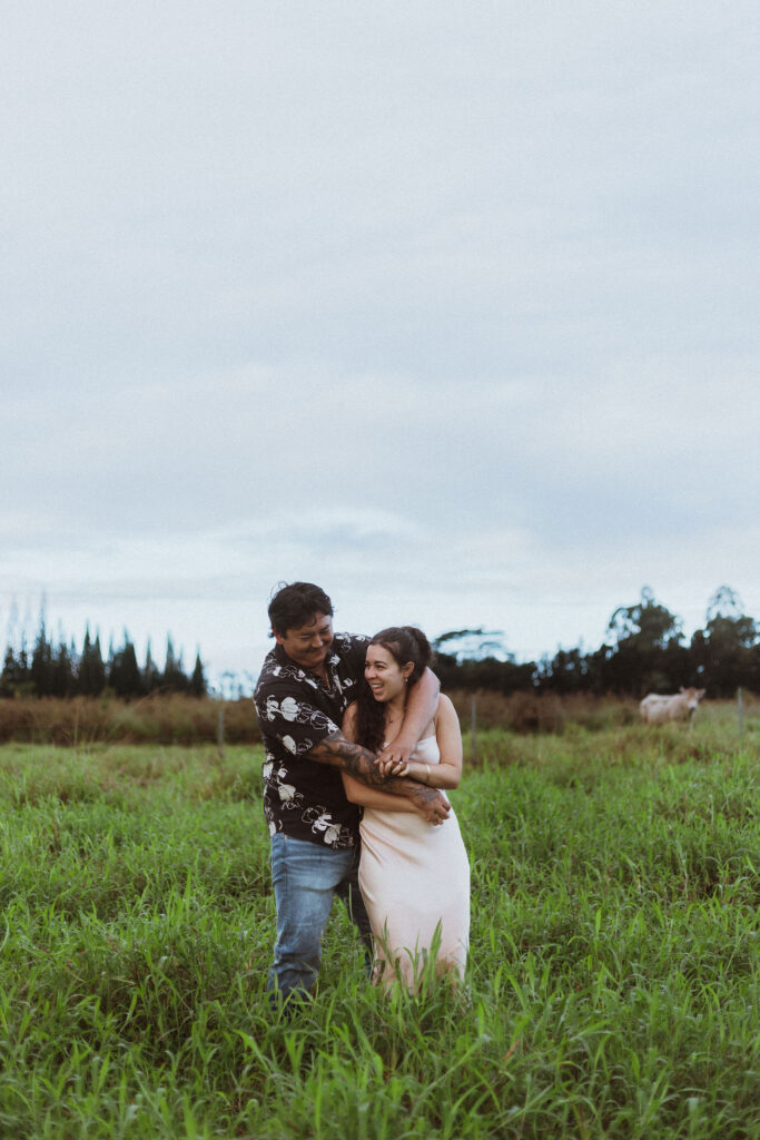 couple at their playful photoshoot in hawaii