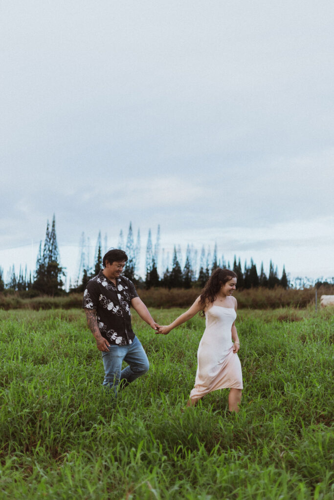 portrait of the newly engaged couple holding hands