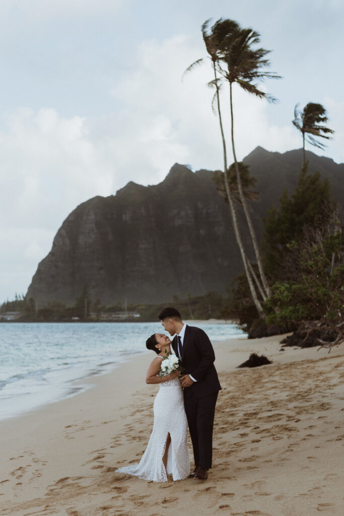 groom kissing the bride on the cheek