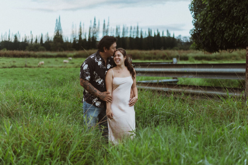 fiance kissing his fiance on the forehead