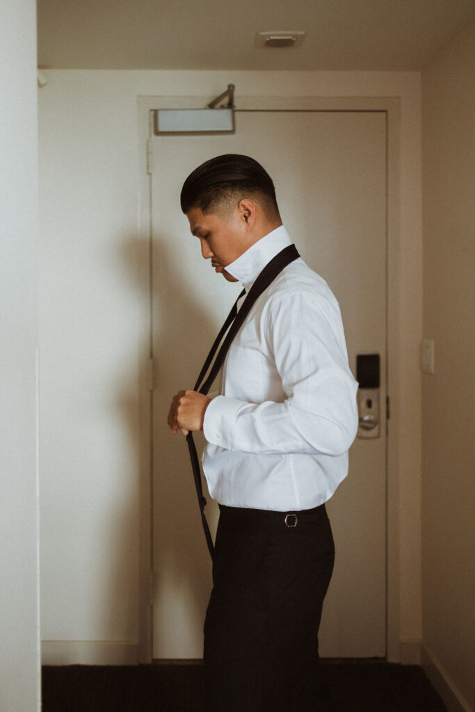 groom getting ready for his intimate ceremony