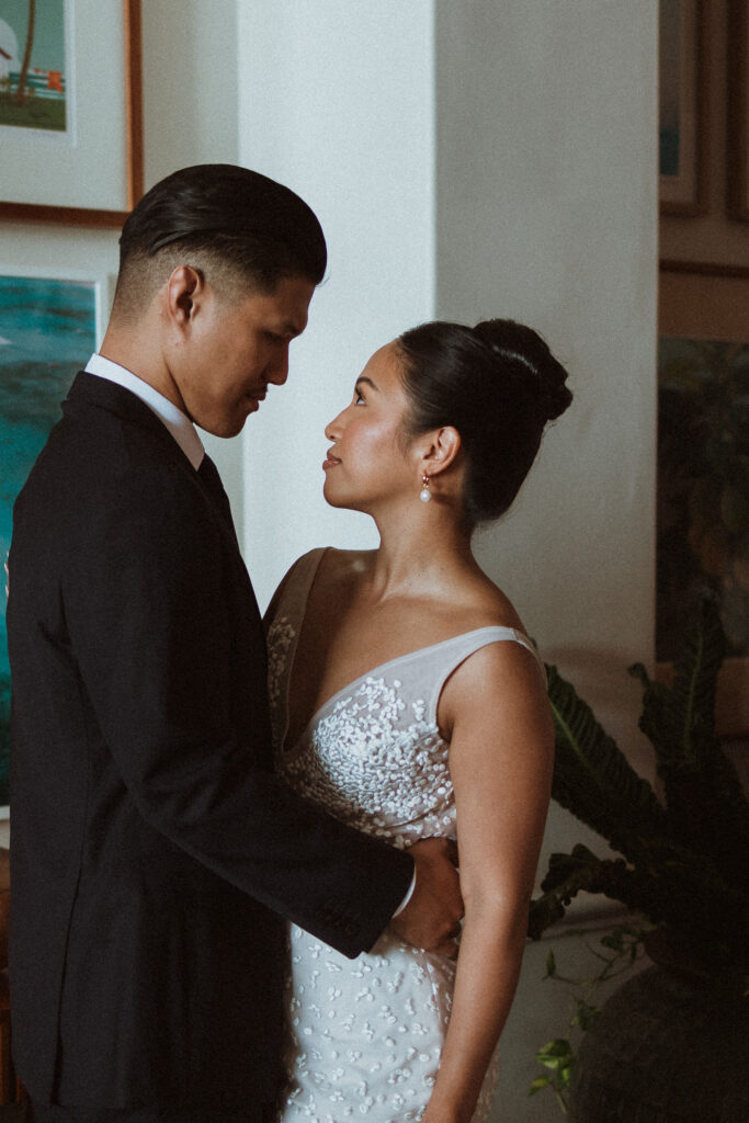 cute portrait of the bride and groom smiling at each other