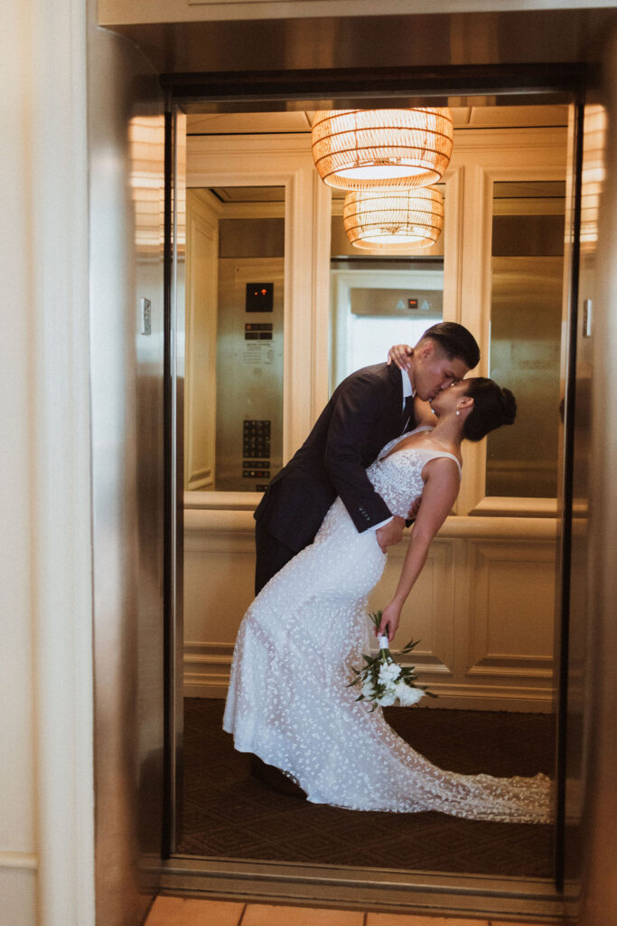 portrait of the bride and groom kissing