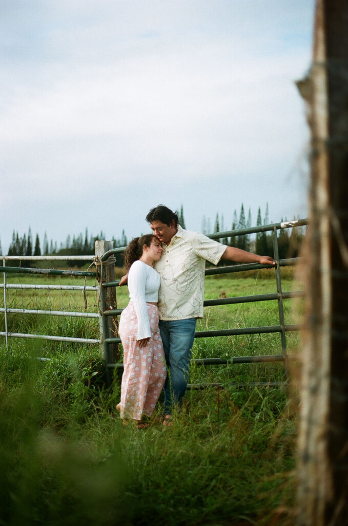 fiance kissing his fiance on the forehead 
