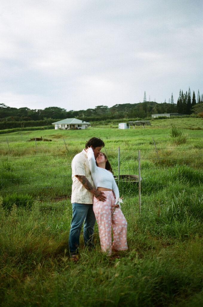 cute portrait of the newly engaged couple kissing
