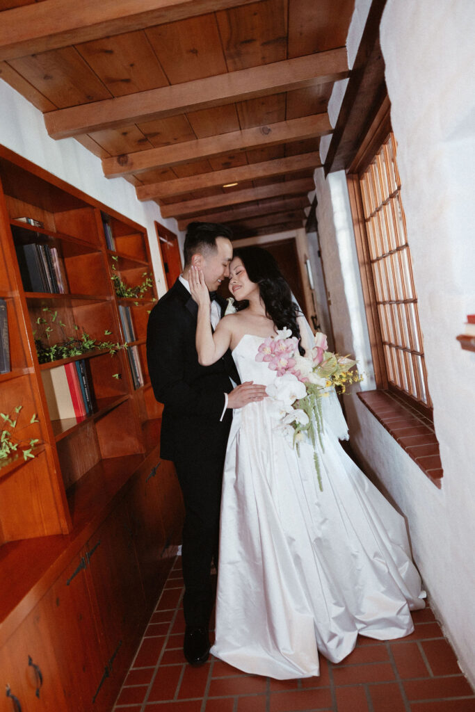 groom kissing the bride on the forehead