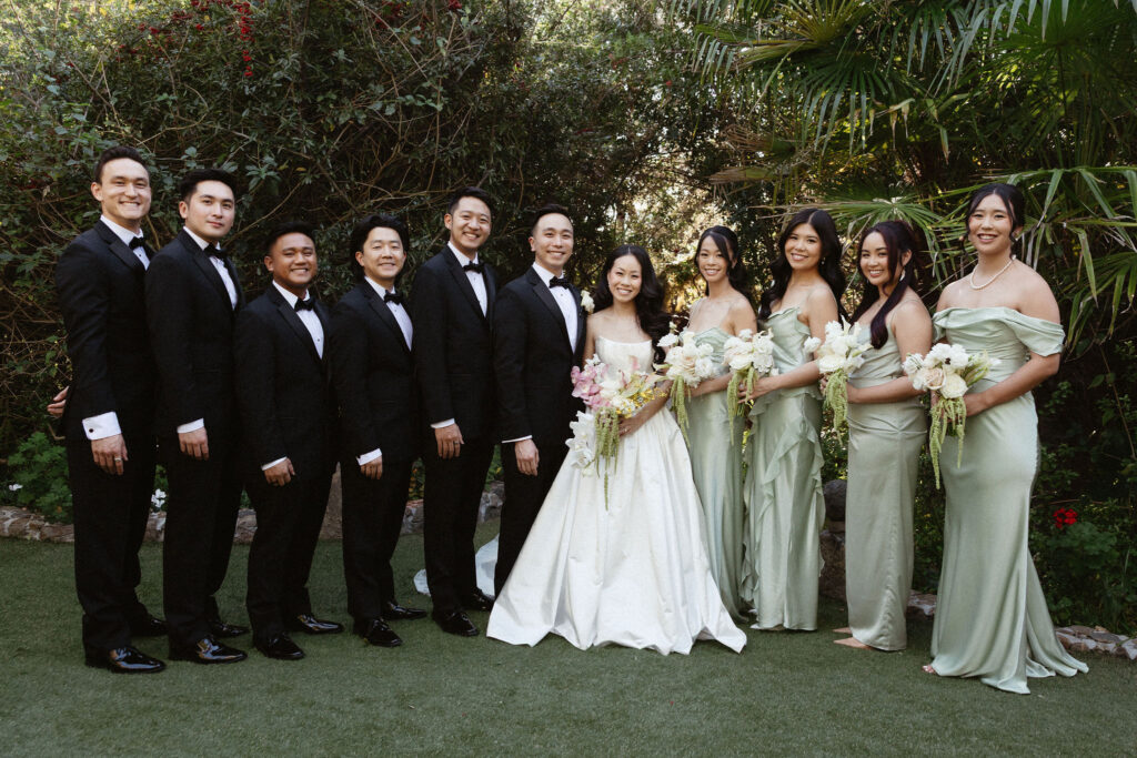 cute picture of the bride and groom with their bridal parties