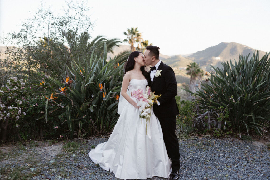 cute picture of the newlyweds kissing