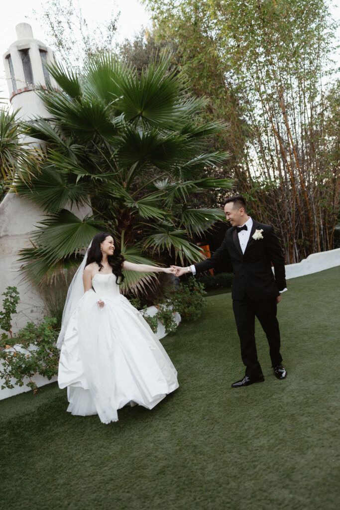 bride and groom holding hands during their bridal portraits