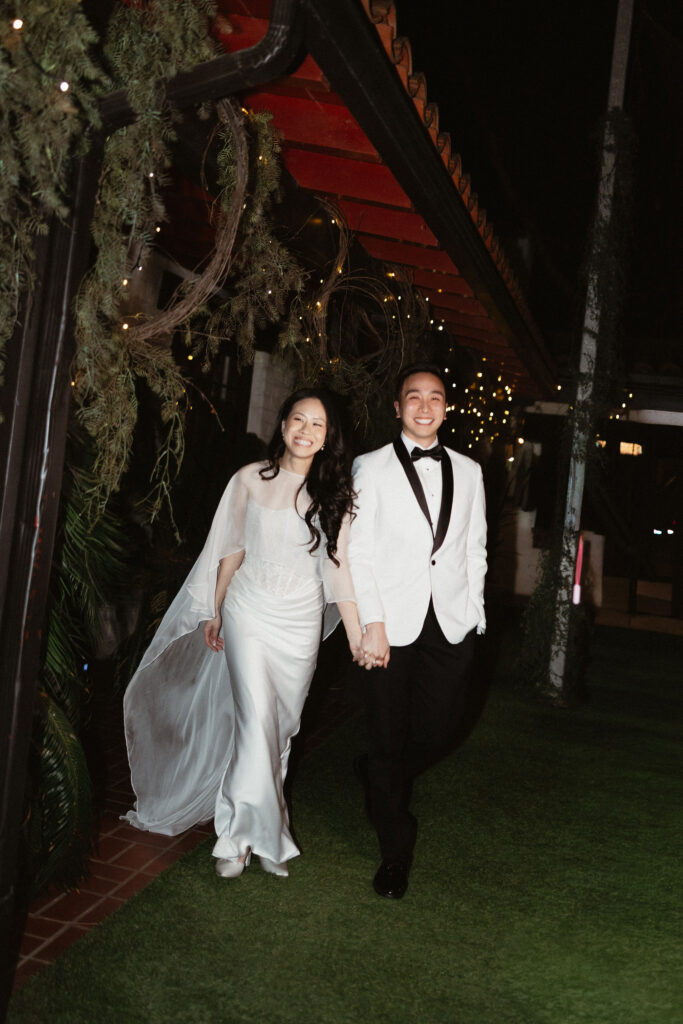 cute picture of the newlyweds arriving at their wedding reception