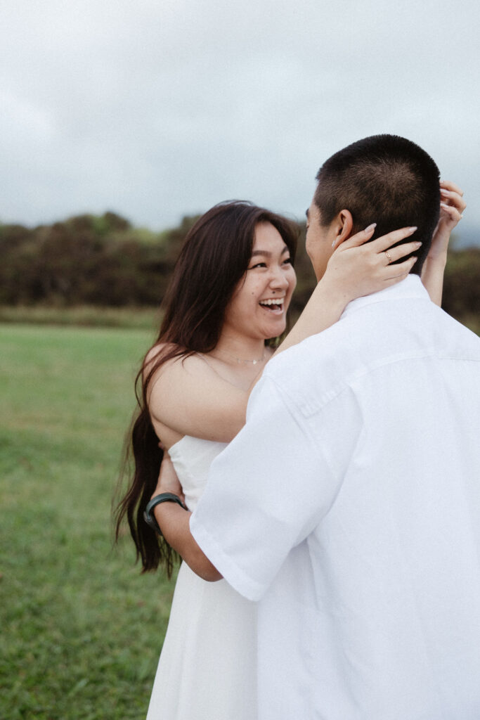 couple laughing with each other during their photoshoot