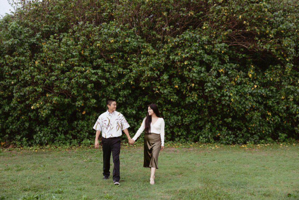 cute picture of the newly engaged couple holding hands