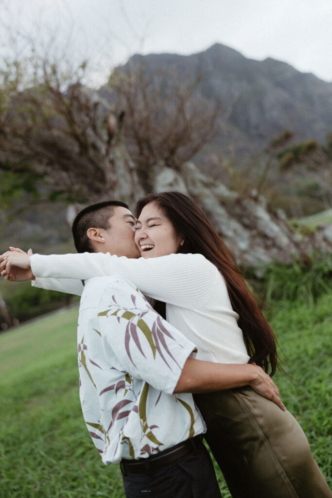 fiance kissing his fiance on the cheek