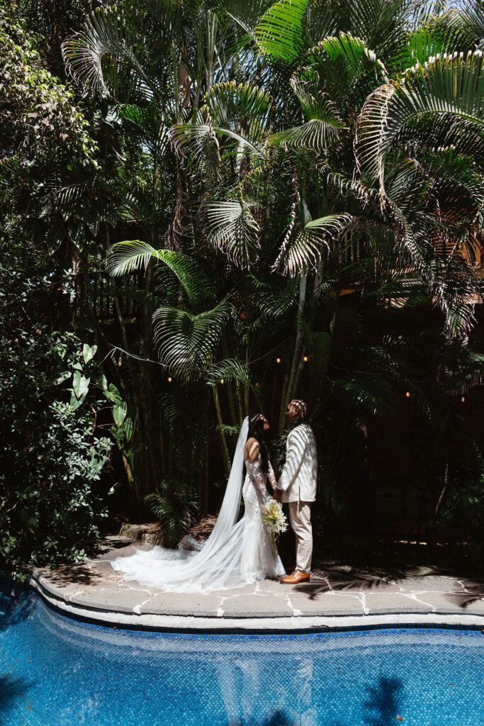 cute portrait of the bride and groom holding hands