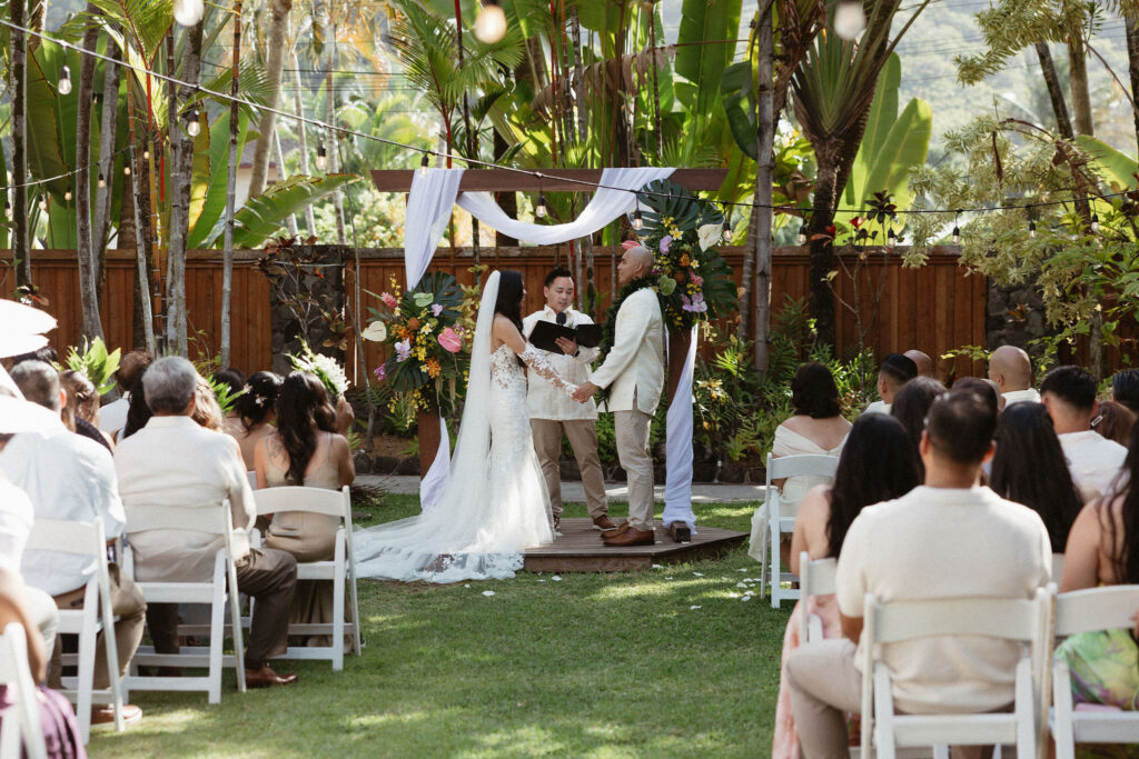 bride and groom holding hands during their wedding ceremony