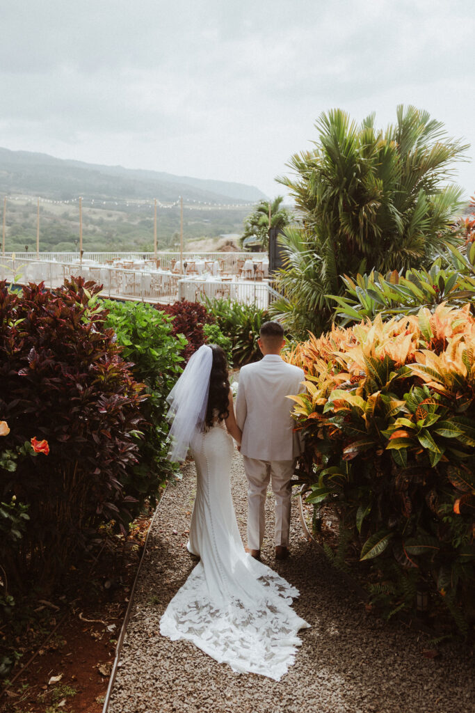 bride and groom walking around their wedding venue