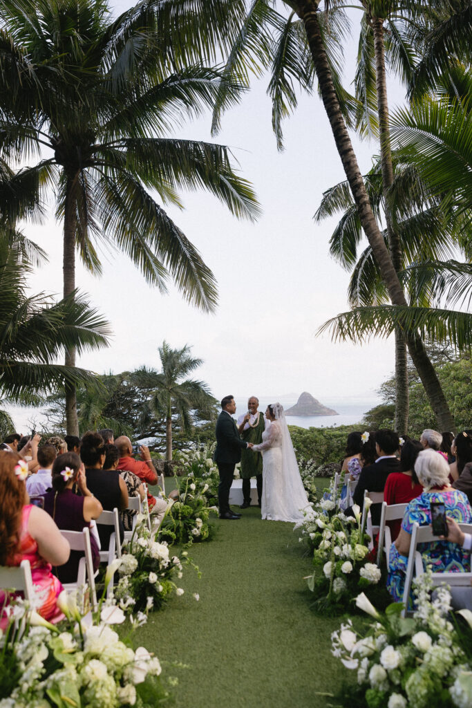 bride and groom holding hands during their wedding ceremony