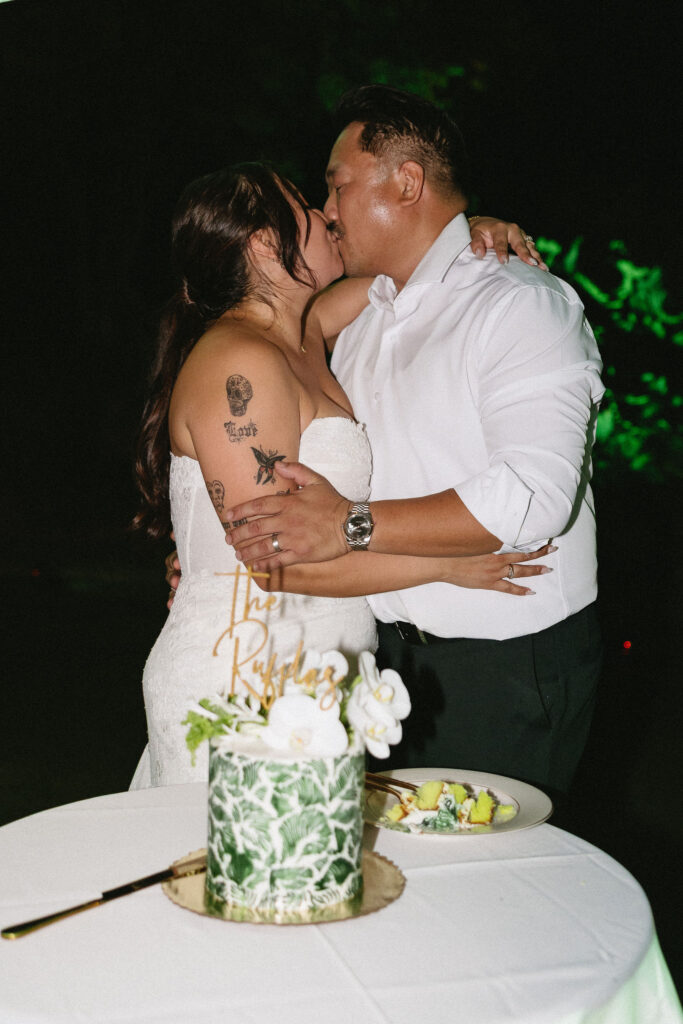 newlyweds cutting their wedding cake
