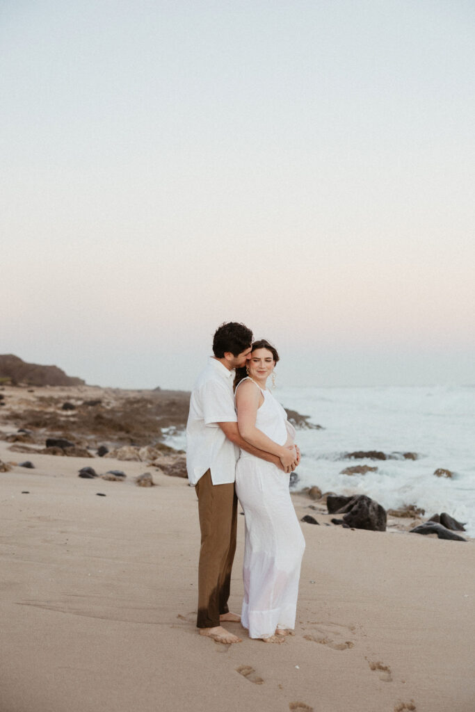 cute picture of the couple hugging during their maternity session