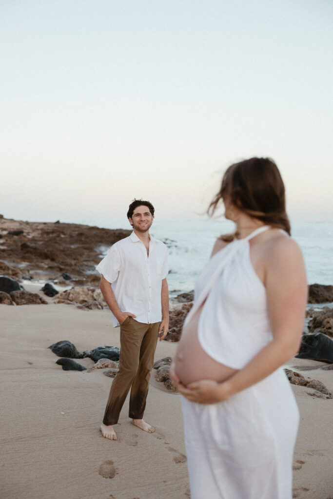 cute picture of the couple smiling at each other during their photoshoot