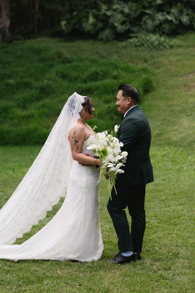 cute picture of the bride and groom smiling with each other
