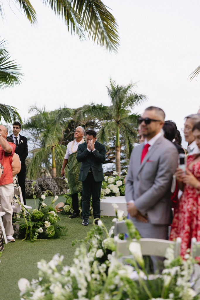 groom emotional watching the bride walk down the aisle