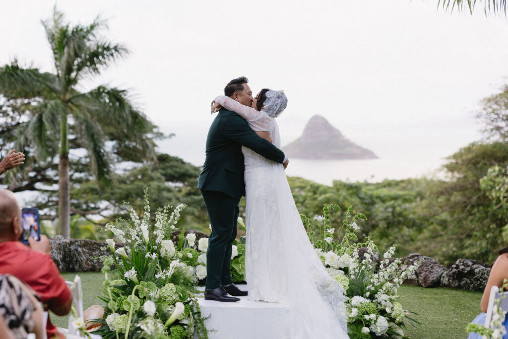 cute picture of the newlyweds kissing after their ceremony