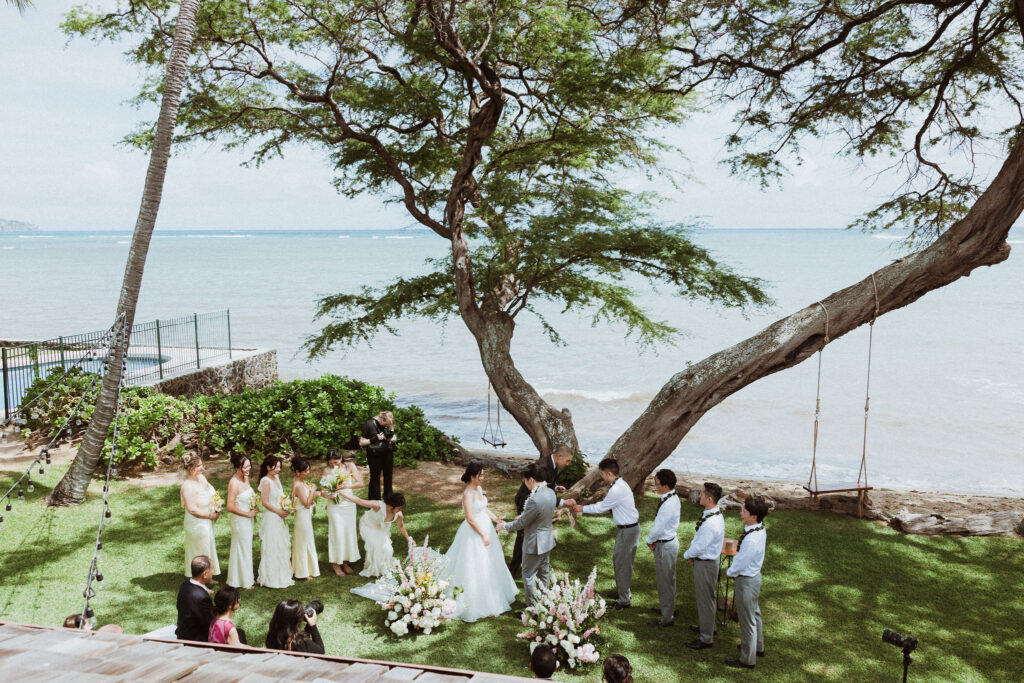 bride and groom holding hands during their wedding ceremony