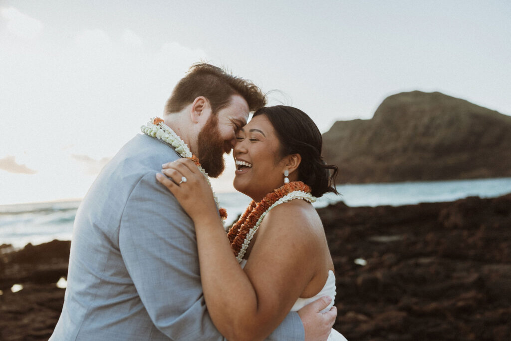 cute picture of the bride and groom laughing with each other