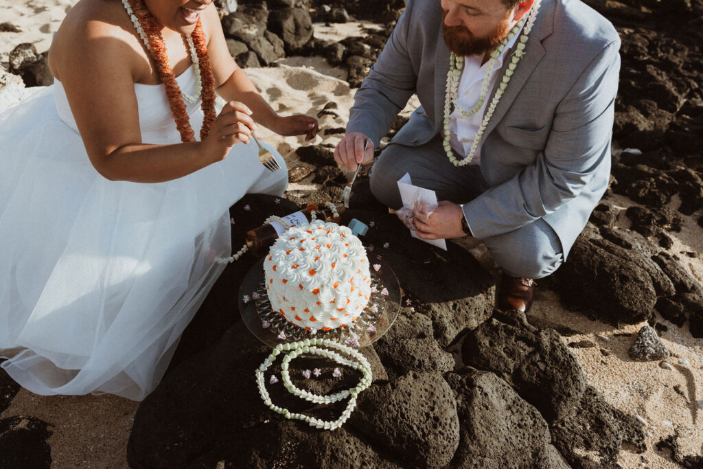 couple trying their vow renewal cake