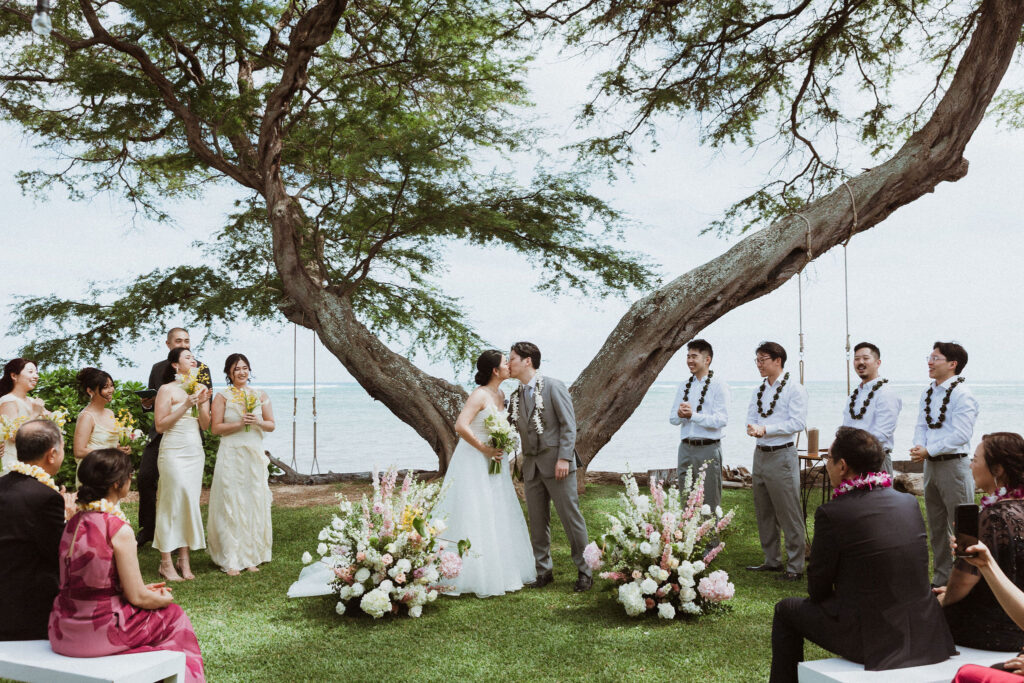 newlyweds kissing after their wedding ceremony