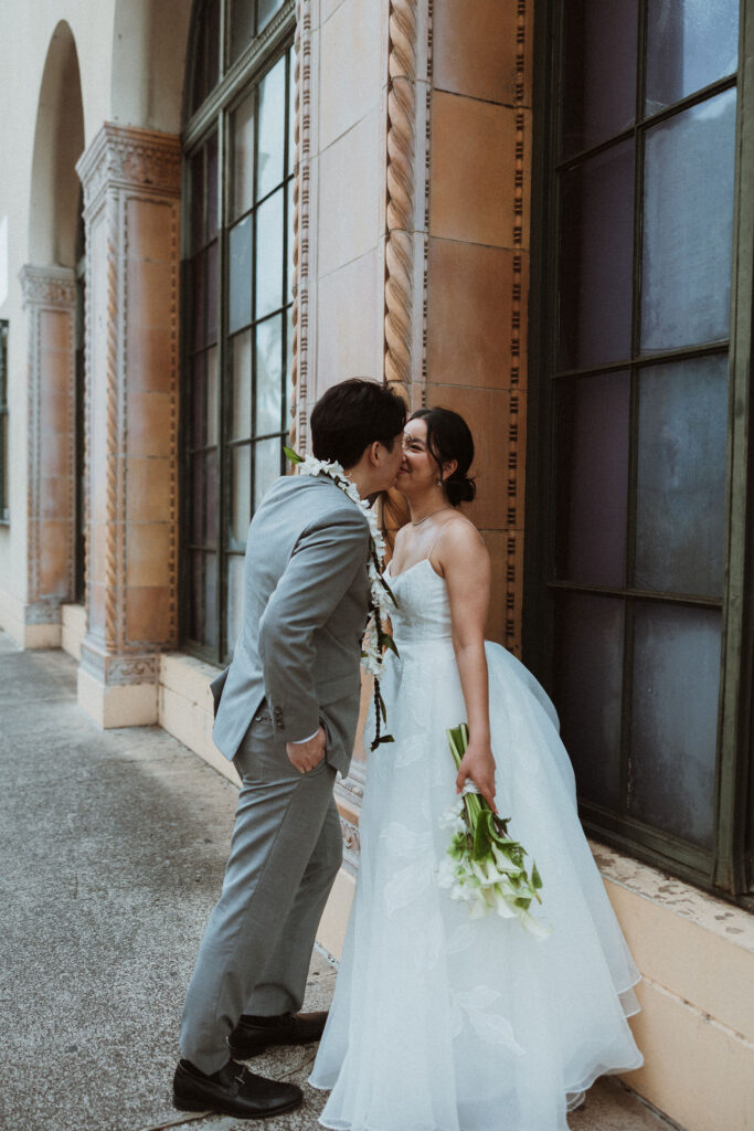 cute picture of the bride and groom kissing