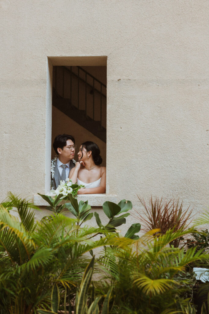 groom kissing the bride on the forehead