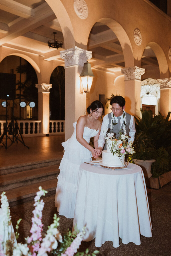 newlyweds cutting their wedding cake