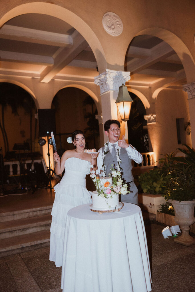 cute picture of the newlyweds trying their wedding cake