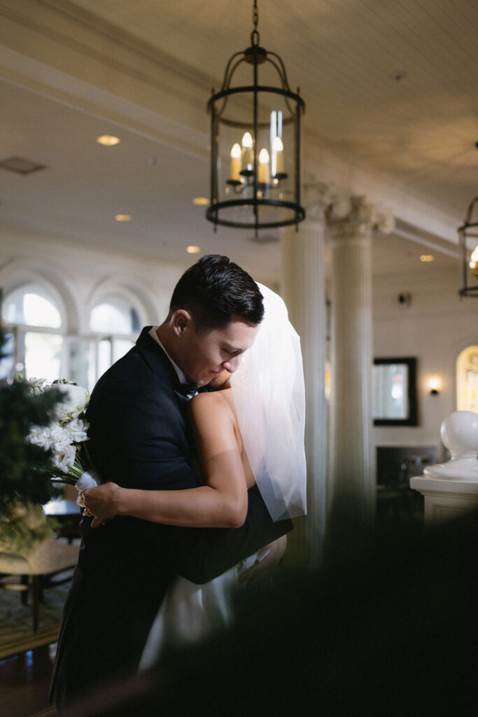 bride and groom hugging during their first look