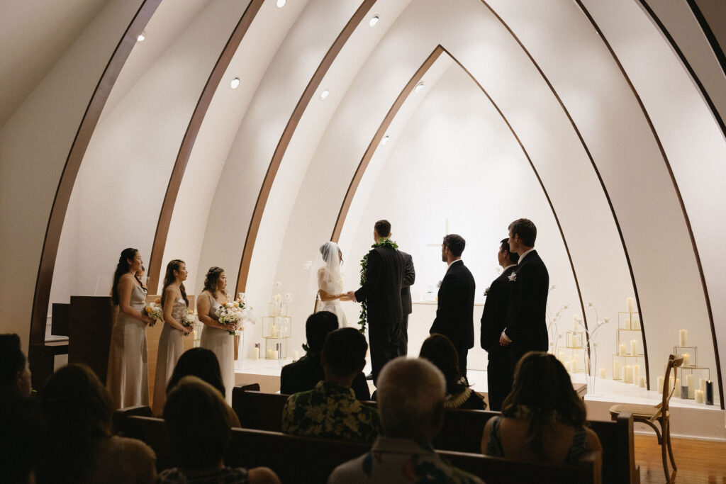 bride and groom holding hands during their ceremony