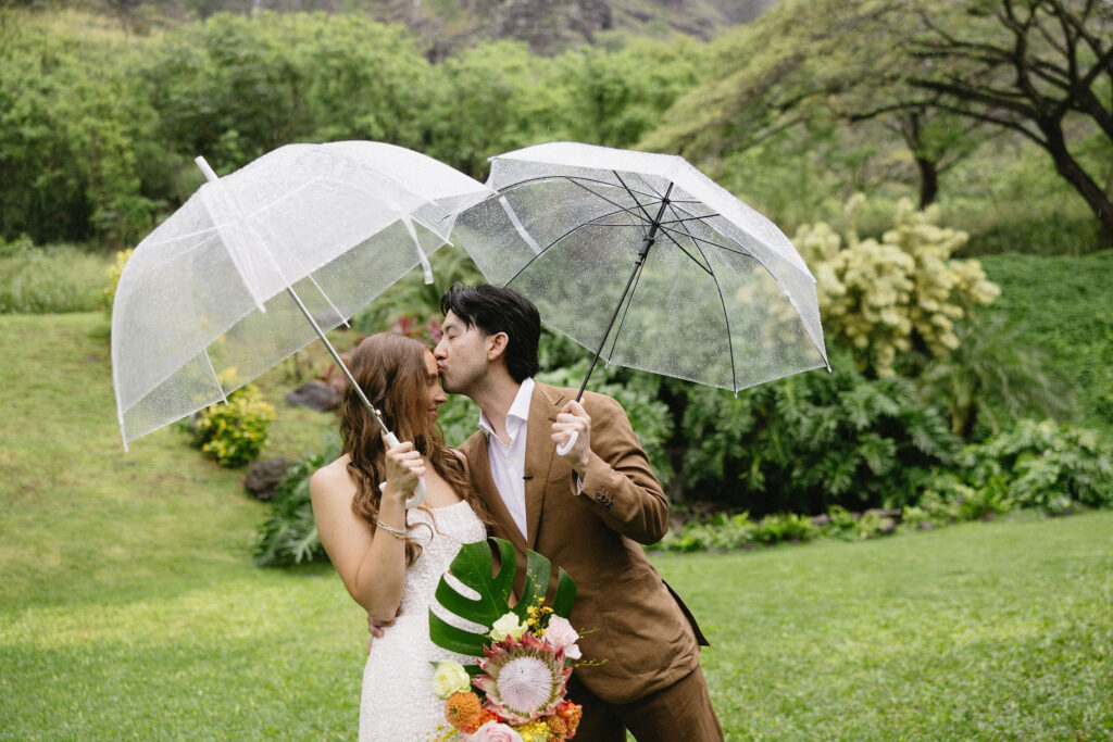groom kissing the bride on the forehead