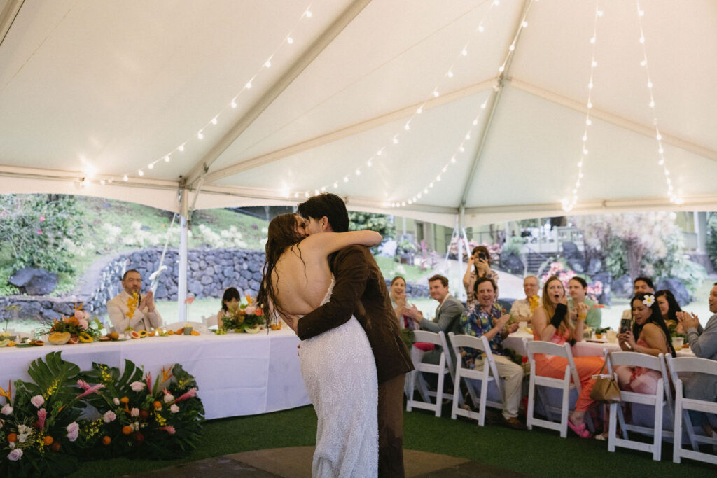 groom kissing the bride on the cheek
