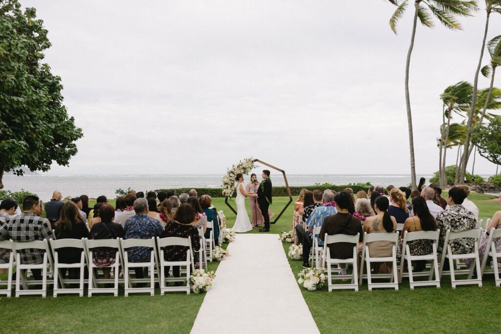 bride and groom holding hands during their wedding ceremony