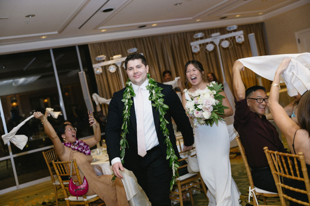 newlyweds arriving at their wedding reception