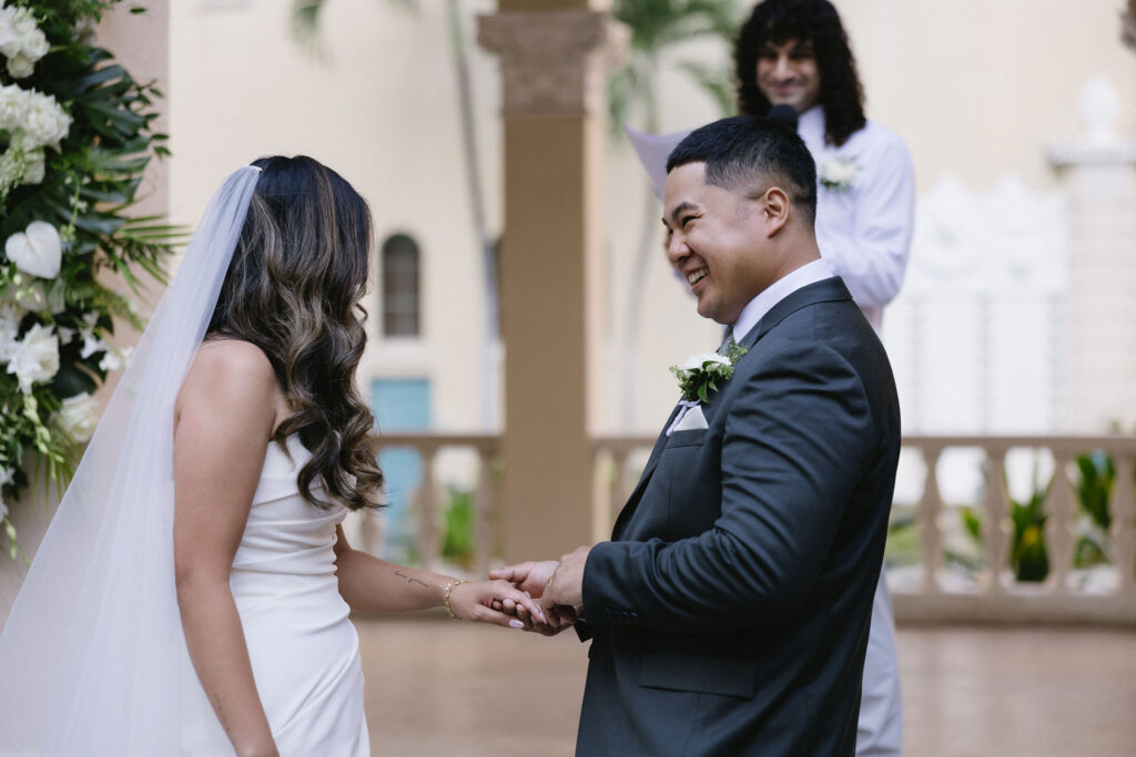 cute picture of the bride and groom holding hands