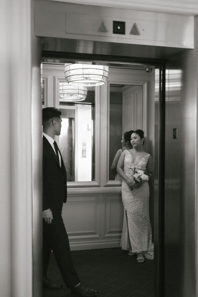 bride and groom smiling at each other