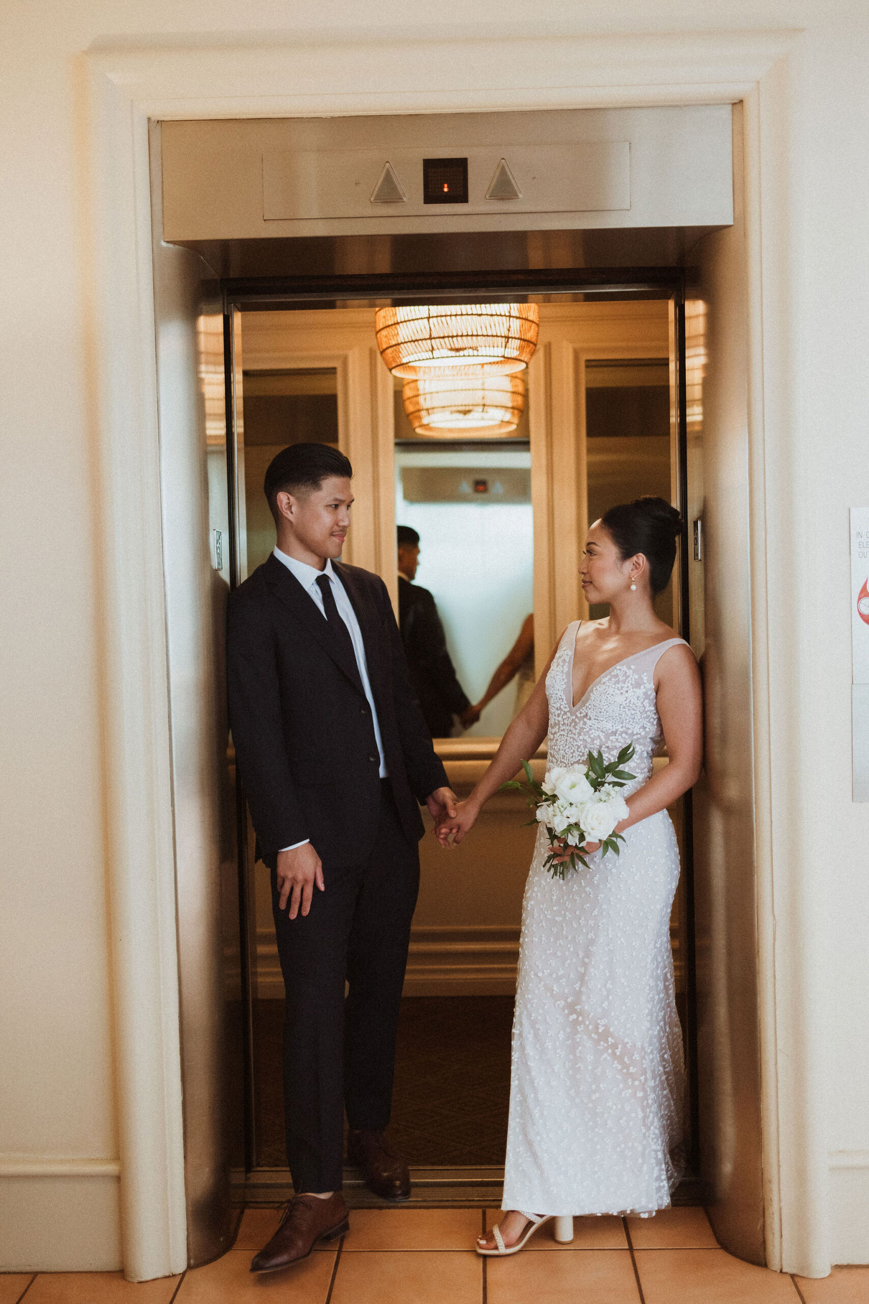beautiful portrait of the bride and groom holding hands