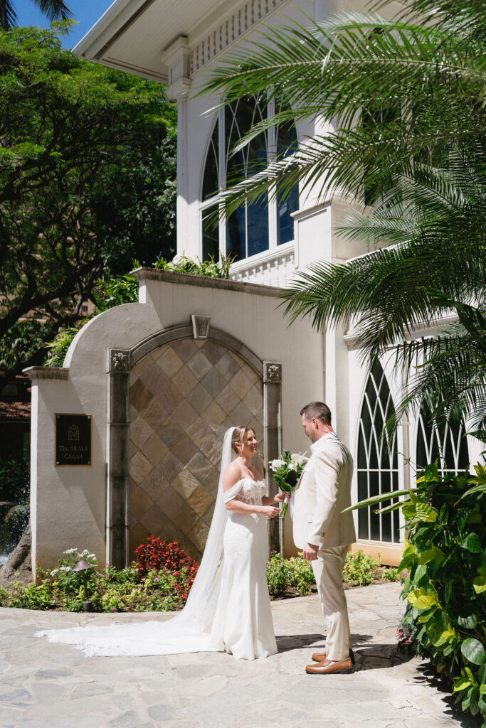 bride and groom holding hands during their first look