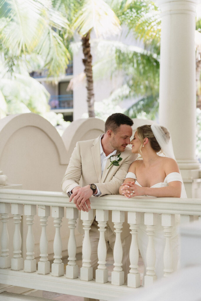 bride and groom smiling at each other